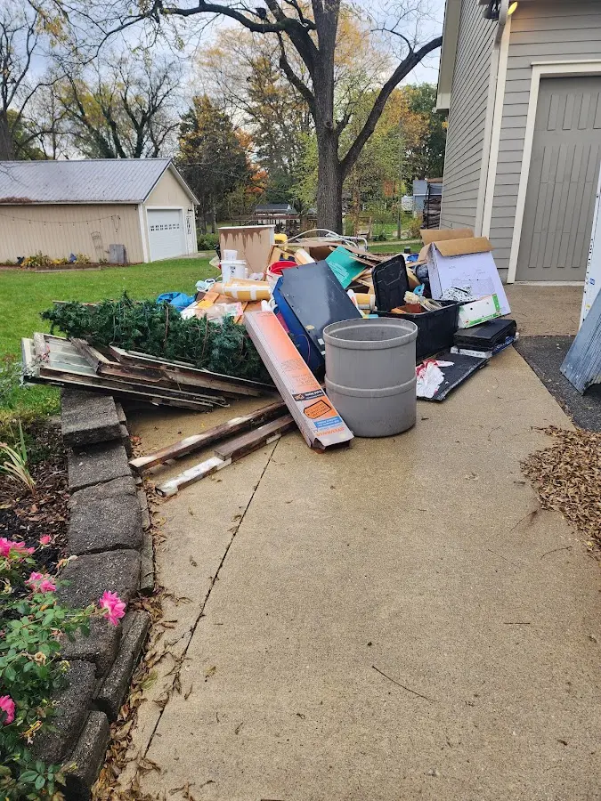 Dumpster being loaded with debris for 3 Yard Dumpster Rental in San Jacinto